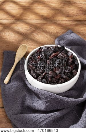 Healthy Food - Nuts Dehydrated Grapes; Photo On Wooden Background