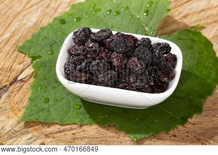 Healthy Food - Nuts Dehydrated Grapes; Photo On Wooden Background