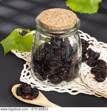 Healthy Food - Nuts Dehydrated Grapes; Photo On Dark Background
