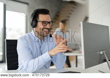 Portrait Of Dedicated Female Operator Agent Working At It Support Sector
