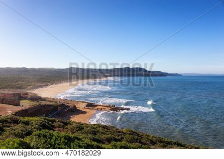 Sandy Beach On The Sea Coast. Fontanamare, Sardinia, Italy. Nature Background