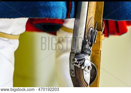 The Bolt Of An Old Flintlock Gun Or The Lock Of A Gun In The Marching Position On An Old Weapon