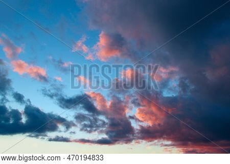 Heavenly Landscape With Pink Clouds On Purple Sky During Sunset. Beautiful Evening Sky With Reddish 