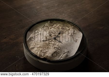 Old And Vintage Blank Clock Dial Without Hand On Old Wooden Table