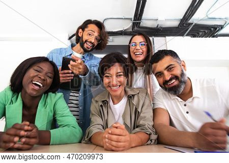 Screen View Of Group Of Multiracial Coworkers Looking At Camera And Lauging During Video Call In The