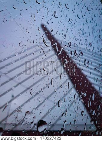 Drops Of Water On The Glass. Drops Of Rain On The Car Glass. Rain On The Glass. Cable-stayed Bridge.