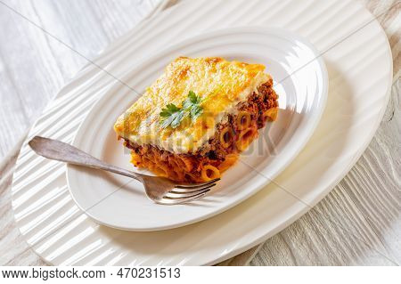 Cllose-up Of Greek Pastitsio Of Macaroni, Ground Meat, Grated Cheese, And Tomatoes Topped With Becha