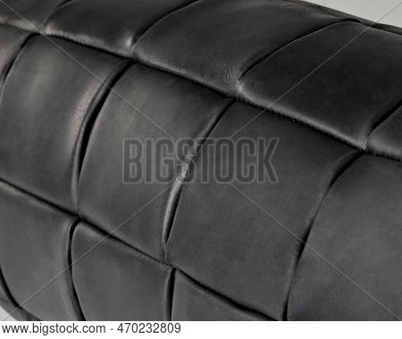 Closeup Of Bolster Pillow From Patches Of Black Genuine Leather