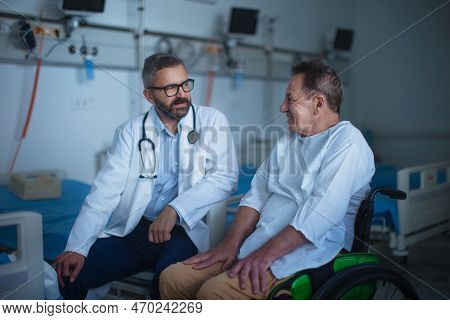Mature Doctor Explaining Diagnosis To Her Patient.