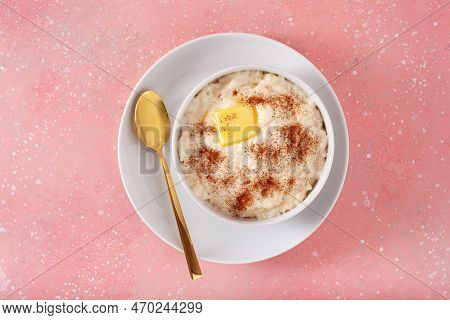 Rice Pudding With Butter Cinnamon. French Riz Au Lait, Norwegian Risgrot, Traditional Breakfast Dess