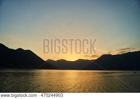 View Of The Sunset In Boko-kotor Bay In Montenegro. Silhouettes Of Mountains