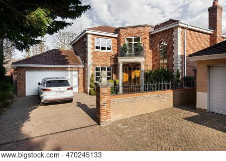 Newmarket, Suffolk, England - April 1 2019: Detached Brick Built Luxury Home With Portico To Front D