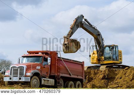 Excavator Loading Sand In Rear-end Tipper Heavy Vehicle Work Dump Tractor