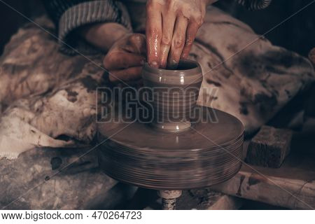 Modeling Bowl From Clay On Wheel In Pottery Workshop. Hands Of Craftsman Mold Crockery. Technique Of