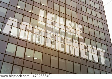 Business Concept. On The Glass Surface Of The Business Center There Is An Inscription - Lease Agreem