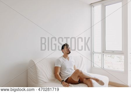 Single Asian Man Playing With His Sugarglider Pet Alone In His Apartment. High Quality Photo