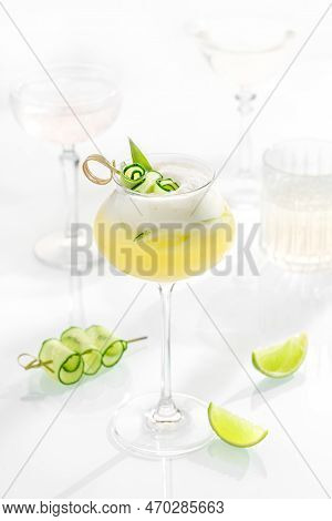 Cocktail Mix In Glass On White Background With Alcohol, Cucumber, Lemon And Lime, Cetriolo.