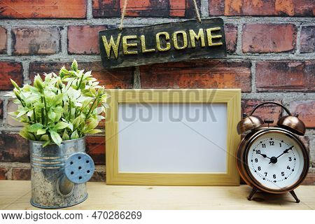 Empty Photo Frame Mock Up With Welcome Sign And Artficial Plant Home Decoration