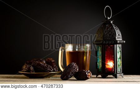 Ramadan Food And Drinks Concept.  Ramadan Lantern With Arabian Lamp, Wood Rosary, Tea, Dates Fruit A