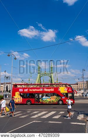 A Doubledecker Tourist Bus Transports Tourists Through The Streets Of The City. Budapest, Hungary - 
