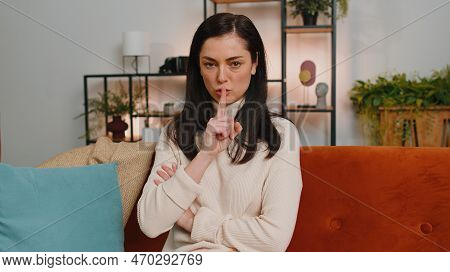 Shh Be Quiet, Hush Please. Young Woman With Brunette Hair Presses Index Finger To Lips Makes Silence