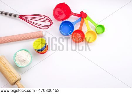 Top View Set Of Kitchen Utensils And Ingredients For Bakery On White Background. Materials Or Kitche