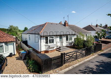 Newmarket, Suffolk, England - August 31 2018: White Extended Detached Bungalow Viewed From Highway.