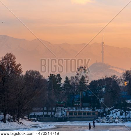 Almaty, Kazakhstan - January 07, 2023: Winter Sunset View From City Park To Koktobe Mountain With Tv