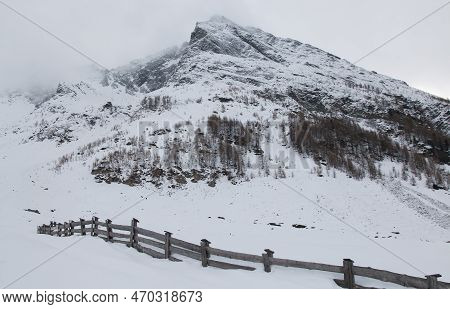 View Of High Mountain Covered By Snow In Winter Season In Italy