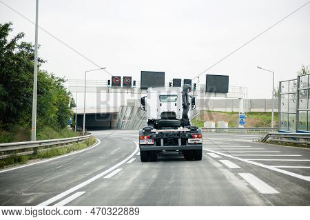 Austria - Sep 30 , 2014: Rear View Of White Mercedes-benz Truck Driving Fast On Empty Austrian Highw