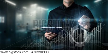 Businessman Analyzes Graph Of Financial Profit Growth And Success On Virtual Computer Screen.
