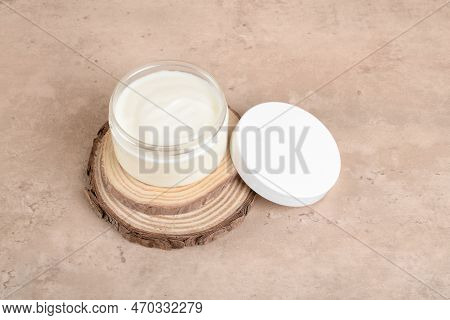 Opened Cosmetic Jar With Facial Moisturizer Cream And Cream Cup Mockup On Wooden Podium On Beige Bac