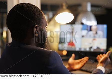 Corporate Manager Explaining Investment Plan To Remote Team During Online Videocall Meeting Conferen