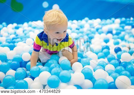 Kids Play In Ball Pit. Child Playing In Balls Pool