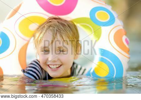 Little Boy Swimming With Colorful Floating Ring In Sea On Sunny Summer Day. Cute Child Playing In Cl