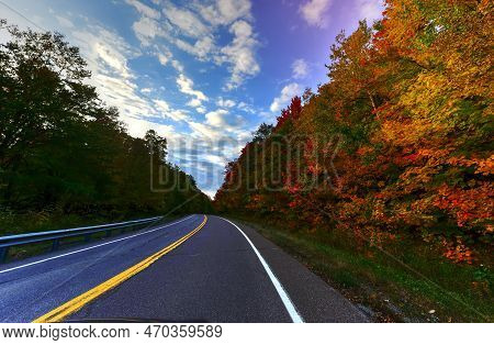 Peak Fall Foliage Along The Road Through Smugglers Notch, Vermont.
