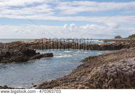 The View Of Seascape With Rocks And Blue Sea In A Sunny Day, Near Mangawhai Heads, Auckland, New Zea