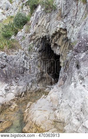 The View Of A Cave Entrance At Mangawhai Cliff Walk, Auckland, New Zealand.