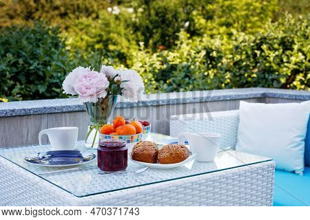 Breakfast Table With Bread, Fresh Fruits And Strawberries And Coffee Served On Balkony Terrace Or Ho