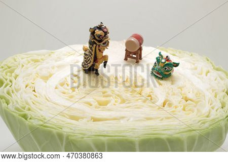 A Figure Of Lion Dance On Cabbage