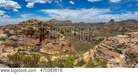 Isalo National Park In Ihorombe Region. Wilderness Landscape With Water Erosion Into Rocky Outcrops,