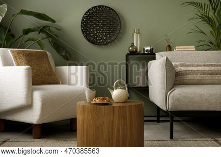 Stylish Composition Of Living Room Interior With Green Wall, Grey Sofa With Grey Pillow. White Armch