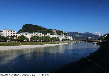 Salzburg, Austria. City View With Elisabethkai Riverfront And Kapuzinerberg Hill.
