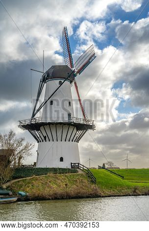 Historical White Windmill Along The Linge River In The Village Of Deil, Province Gelderland, The Net