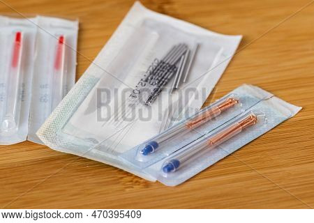 A Close Up Portrait Of Multiple Packages Of Different Acupuncture Needles, Ready To Use On Someone W