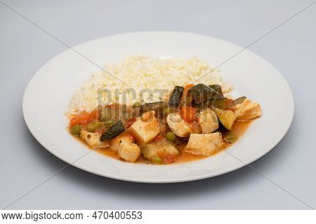 Squid Stew With Vegetables And Boiled Rice On Plate