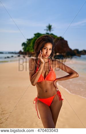 Portrait Of Serene Looking Fit Attractive Young Black Female Posing In Bikini At Exotic Beach By Oce