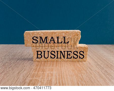 Small Business Symbol. Words Small Business Symbol On Brick  Blocks    On  A Wooden Table On A Beaut