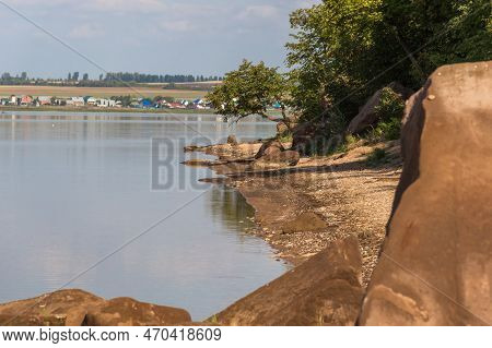 A Body Of Water Surrounded By Green Forest And Rocks, Green Forest On Background