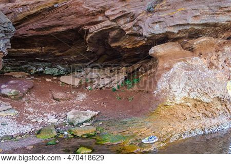 A Large Rock Formation On Rocky Coastline, Wonder Of Nature. Waves In The Process Of Erosion Eroded 